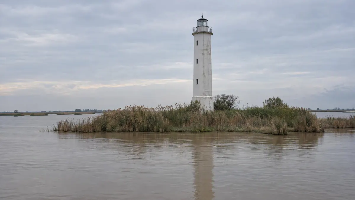 The Punta Maistra lighthouse on an islet of reeds at the mouth of the Po di Pila